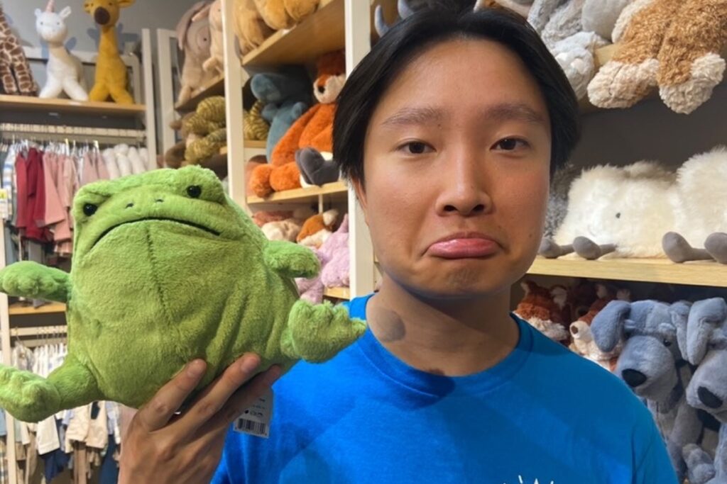 carson holding a frog stuffed animal