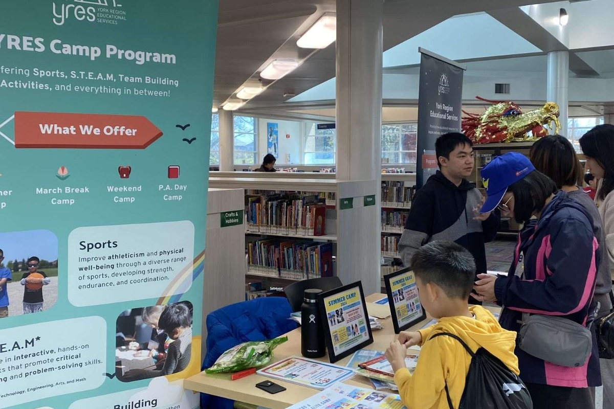 Kid interested at info session booth
