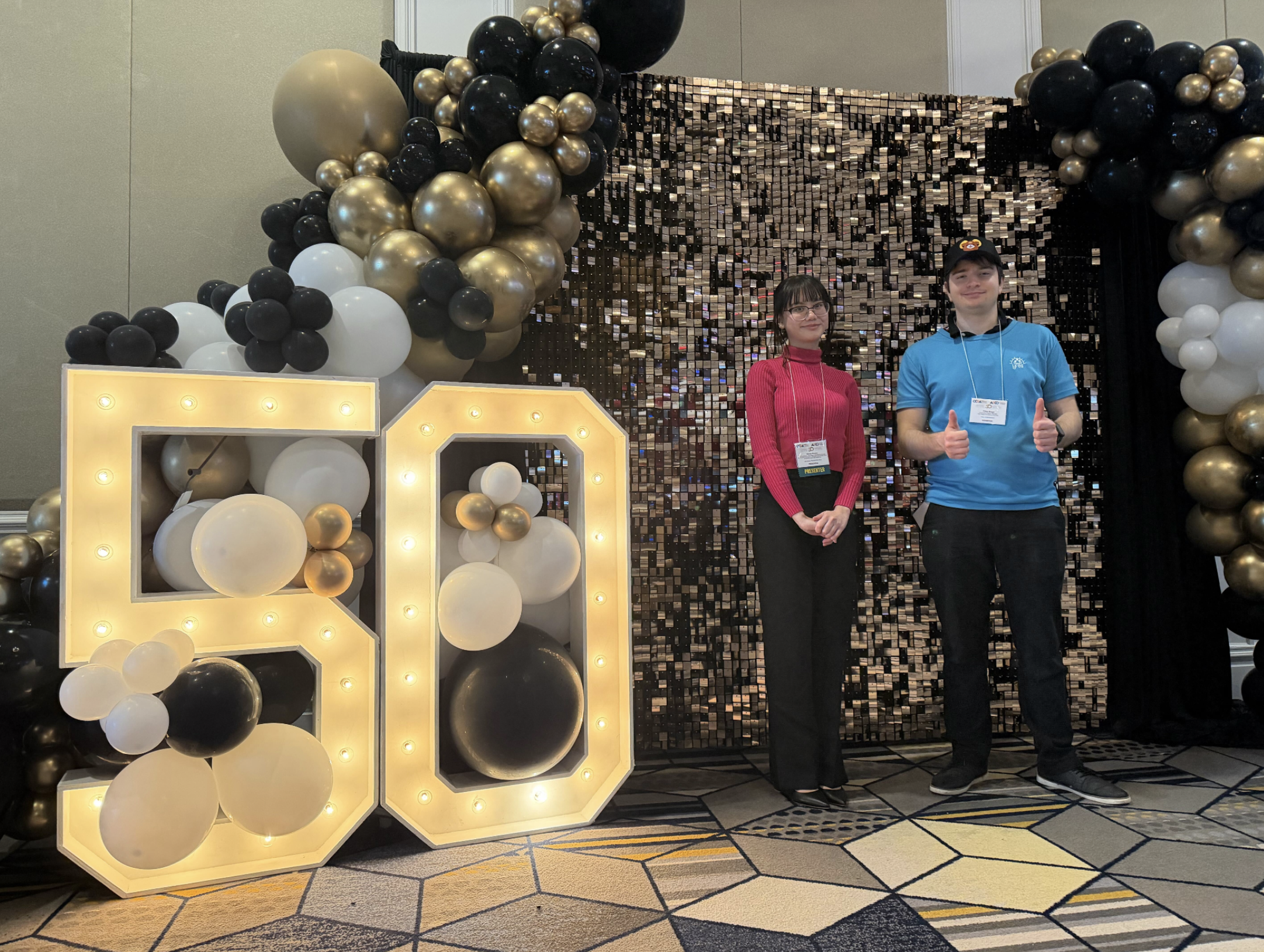 Hanna and Filipe at the OCEA 50th anniversary display
